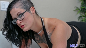 Tattoos and piercings adorn this horny amateur milf
