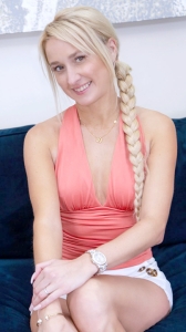 Canadian pornstar MILF Trip Misha Mynx smiles while sitting on Casting Couch