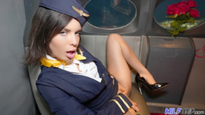 Sexy flight attendant masturbates her horny pussy in mile high club porn video